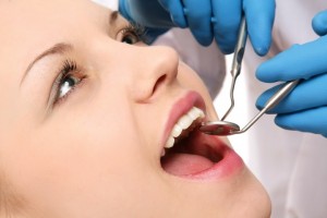 Oral Surgeon Checking Teeth